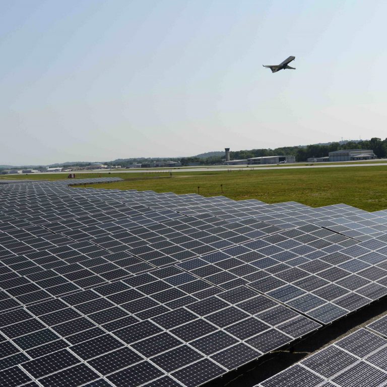 Chattanooga Airport Solar Farm with Plane taking off